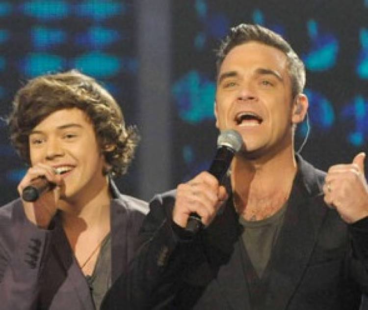 Robbie Williams dijo que "ve mucho" de si mismo en Harry Styles